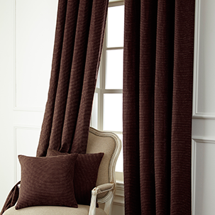 go to drapes and decorative pillow cases brown